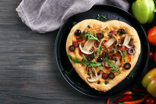 Heart Shaped Pizza On Metal Tray On Wooden Background