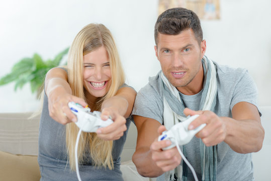Couple playing computer game