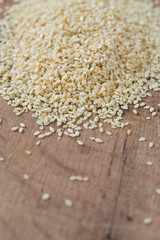 sesame seeds on wooden surface