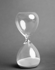 Hourglass on gray background