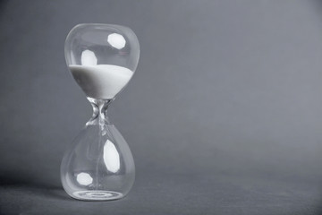 Hourglass on gray background
