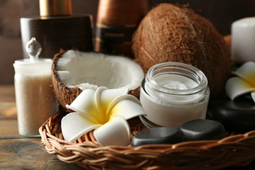 Spa coconut products on dark wooden background