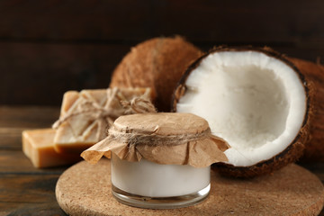 Spa coconut products on dark wooden background