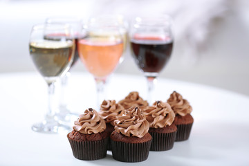 Tasting of wine and chocolate cupcakes, close up