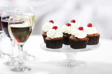 Tasting of wine and chocolate cupcakes, close up