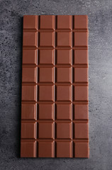 Chocolate bar on dark grey background