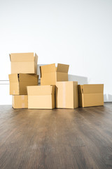 Pile of cardboard boxes on white background with box shadow