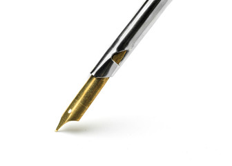 Gold color nib pen isolated on white