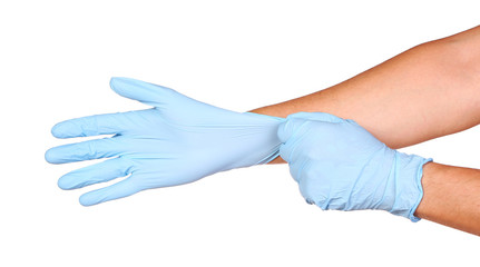 Doctors hands putting in nitrile exam blue latex gloves isolated