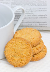 Cookie with coffee cup.