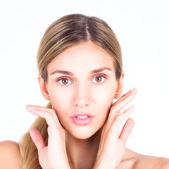 Spa & Beauty. Beautiful and clean face of woman. Beautiful woman touching her face with both hands