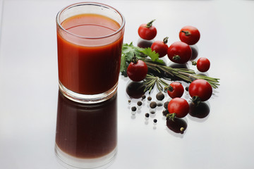 glass of tomato juice drops