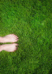 Woman legs on the grass
