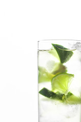 Fresh cocktail with lime slices isolated on white background