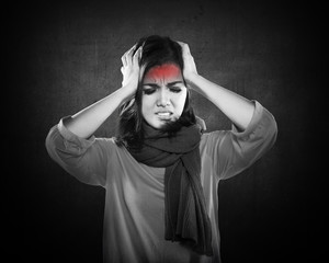 Young sick woman having headache