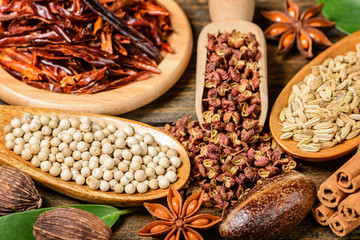 dry white pepper on the wooden board