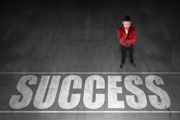 Business person looking success word