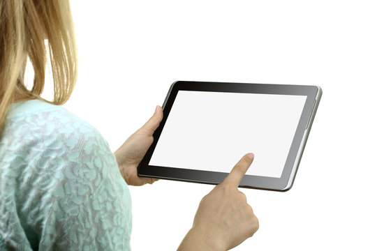 new tablet in the hands of the girl on a white isolated background