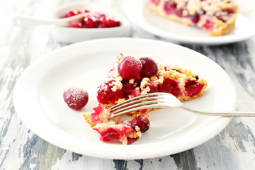 Tasty homemade pie with cherries on table close up