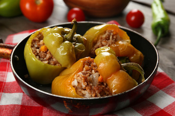 Stuffed peppers with vegetables on table close up