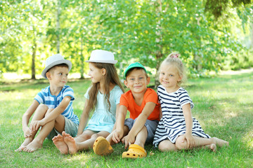 Fototapeta premium Happy active children on green grass in park