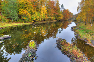 Fototapeta na wymiar Autumn view for Morrum river with water reflection