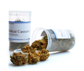 Bottles of dry medical cannabis isolated on white