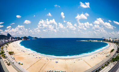 Copacabana beach with city skyline of Rio de Janeiro, Brazil.