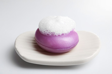 Soap with foam isolated on white