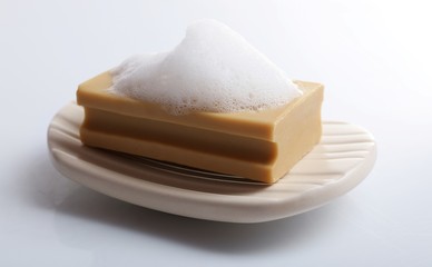 Soap with foam isolated on white