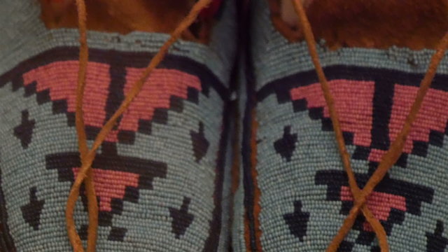 An American Indian clothing with colorful lines. American Indians are native americans who live within the boundaries of the present-day United States 