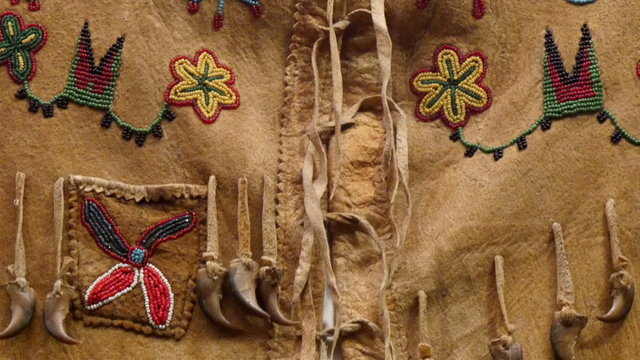 Details of the beads from the American Indian clothings. These are small tiny beads creating flowers and other images with creativity