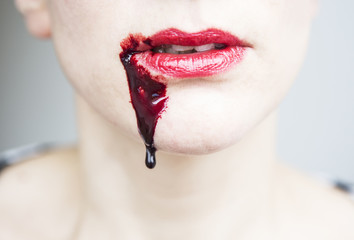 closeup of woman's mouth with blood