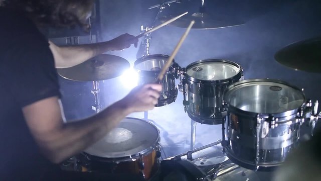 drummer beats on plates