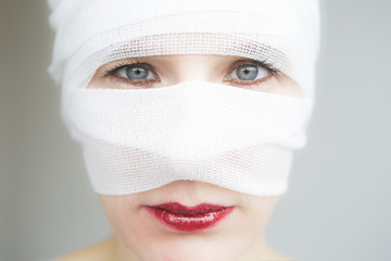 closeup of woman wrapped in bandages