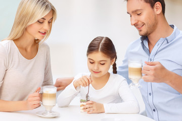 Friendly family sitting in the cafe 