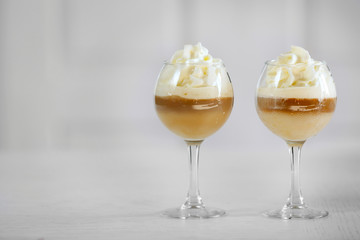 Wine glass with jelly on light background