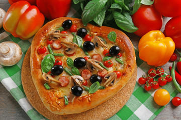 Heart shaped pizza green checked cotton serviette decorated with vegetables