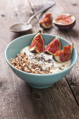 Breakfast with muesli, yogurt, figs