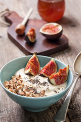 Breakfast with muesli, yogurt, figs