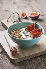 Breakfast with muesli, yogurt, figs