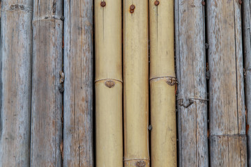 A bamboo background with warm natural tones.