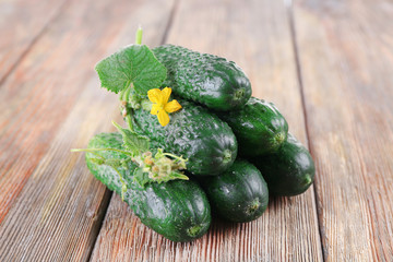 Cucumbers on wooden background