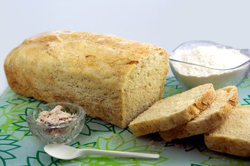 Homemade bread with flour and yeast bread. Background white.