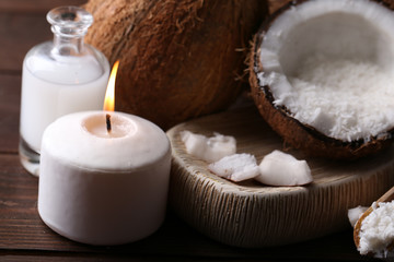 Spa coconut products on dark wooden background