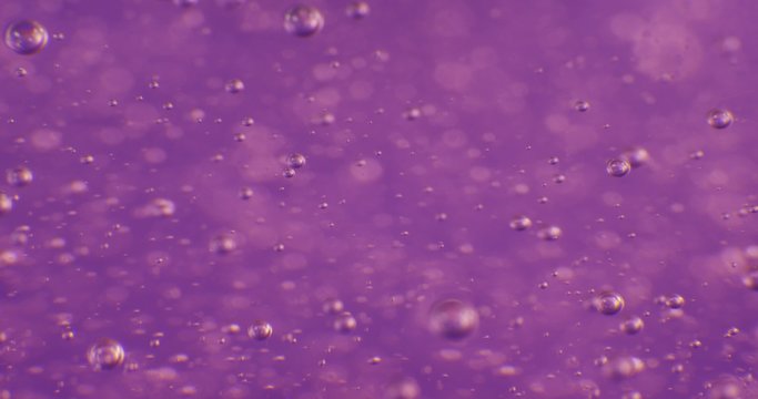 Bubbles in color jello cream (gel soap). Extrime macro 4k