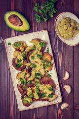 Baked potatoes served with guacamole