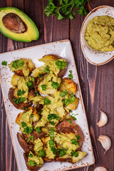 Baked potatoes served with guacamole
