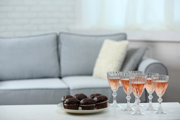 Table at home with food and drinks for friends