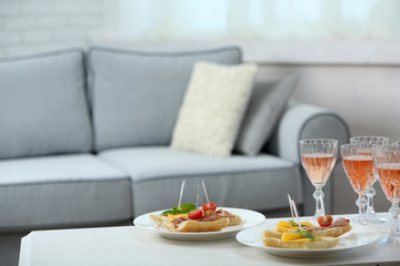 Table at home with food and drinks for friends